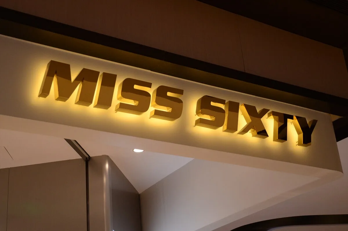 Classic backlit metal letters in gold plated steel with warm white reflected lighting