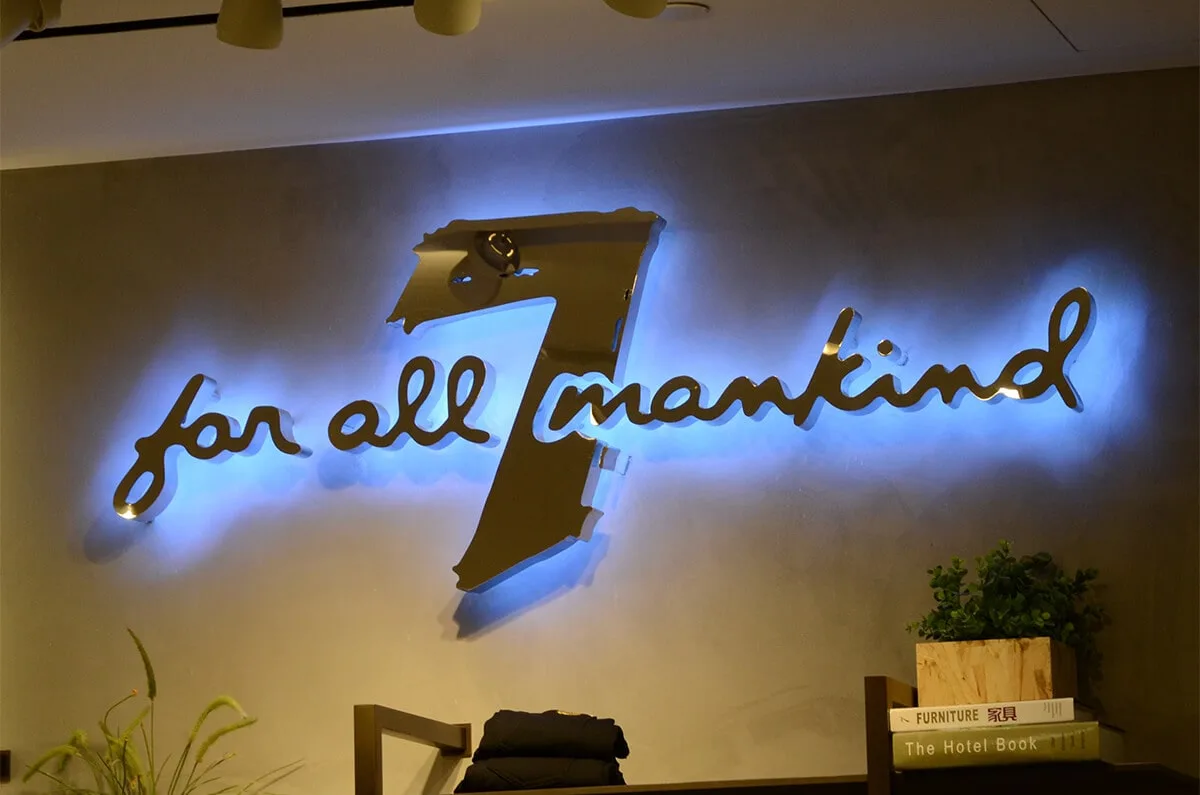 Classic polished stainless steel backlit letters with blue reflected lighting