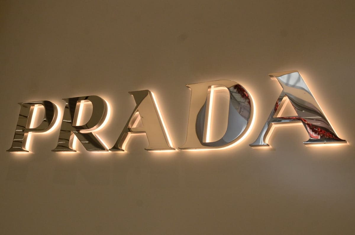 Custom backlit letter signs spelling a brand name with a halo glow on a wall